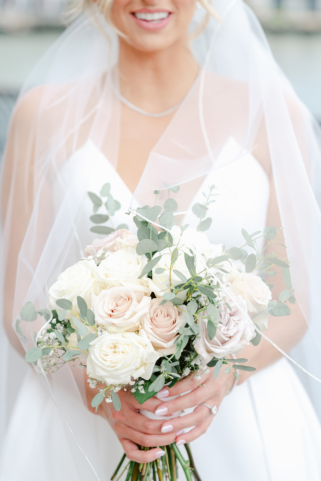Romantic neutral wedding bouquet with cream florals