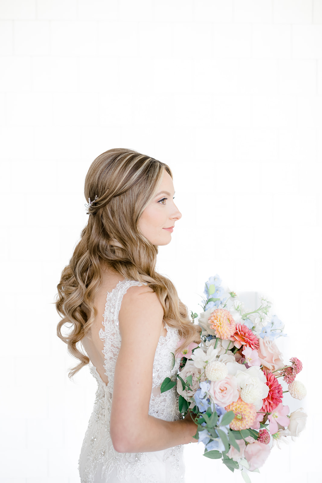 Vibrant wedding bouquet with layered seasonal blooms photographed by New Jersey wedding photographer