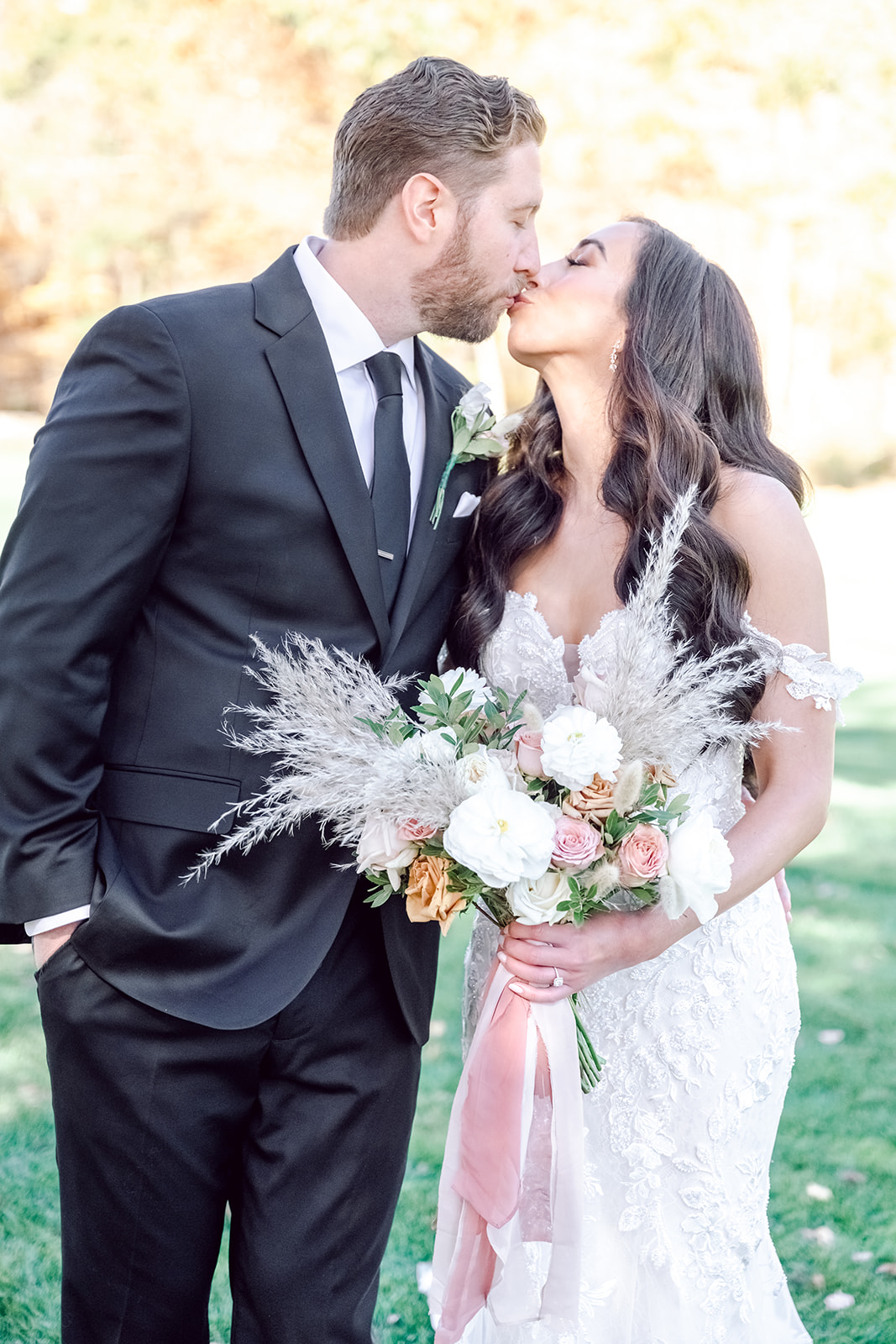 Neutral wedding bouquet with cream florals and natural greenery photographed in New Jersey