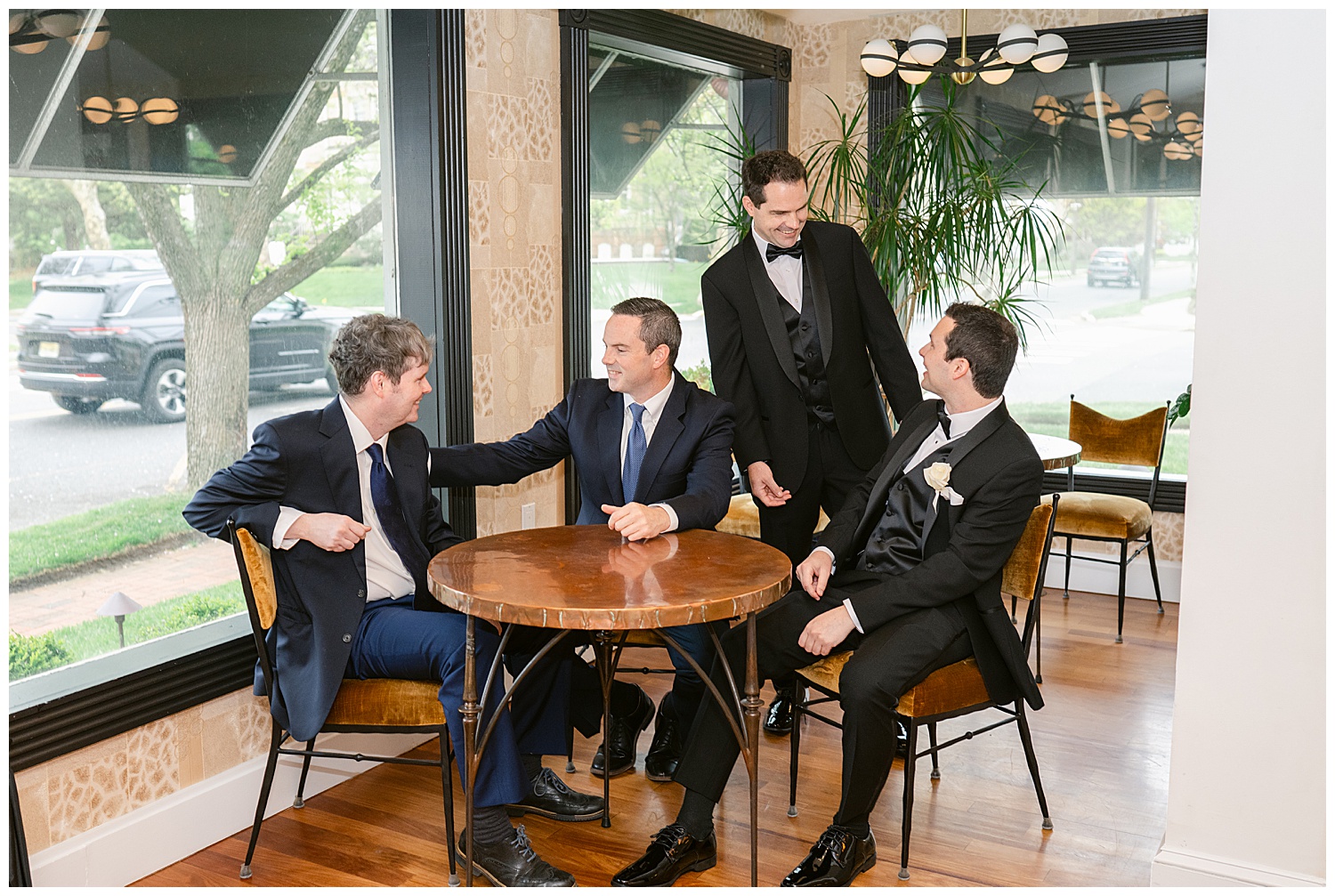 groom with his brothers having a fun time hanging together before wedding