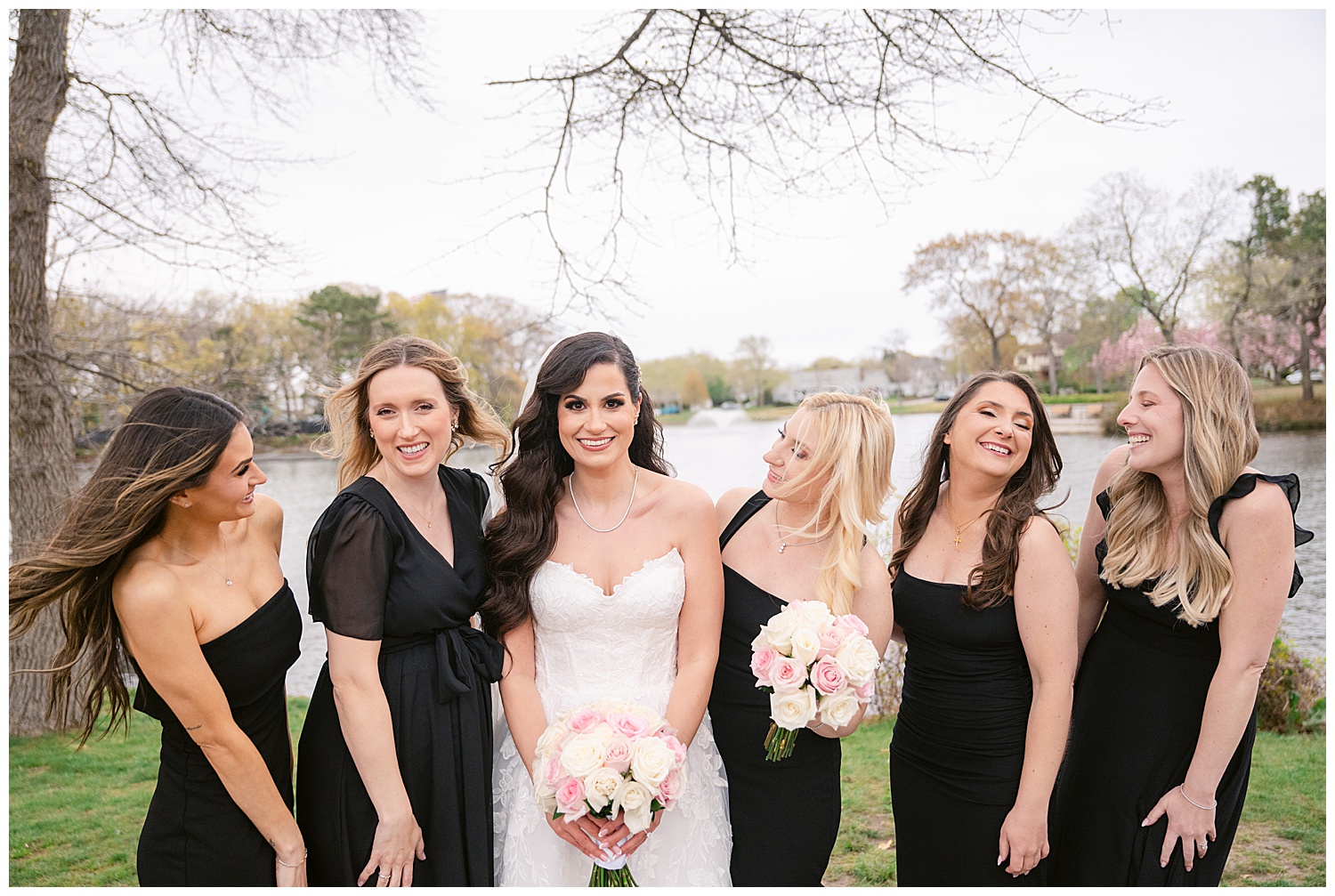 bride and pretty bridesmaids having fun during portrait time in spring lake, nj 