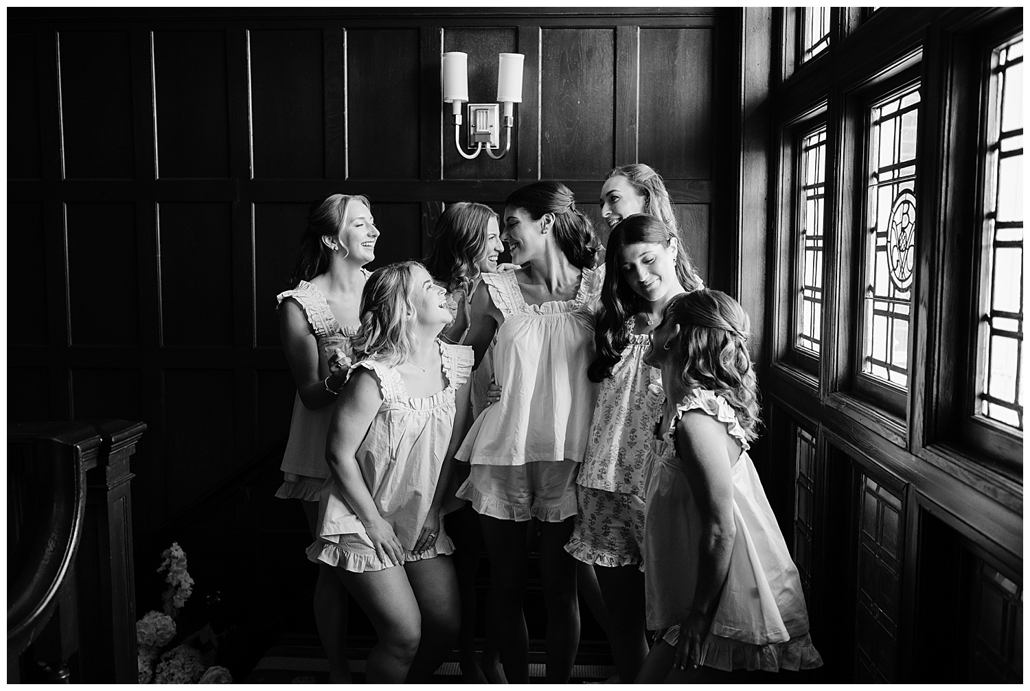 bride and bridesmaid in pajamas laughing